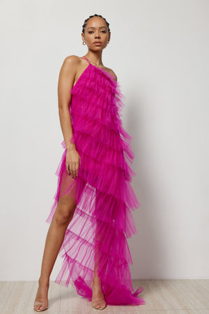 
                  
                    The Astra Dress Pink by Lexi is made of hot pink tulle layers that have been pleated and gathered to create the ultimate statement dress. 
                  
                